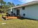 Home with a backyard deck and grill at 161 Coblentz St, Port Charlotte, FL 33954