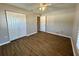 Bedroom with double door closet and wood-look floors at 1762 Napoleon Rd, North Port, FL 34288