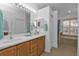 Elegant bathroom with dual sinks, a large soaking tub and a separate shower at 1766 Dunvegan Dr, Punta Gorda, FL 33980