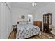 Bright bedroom with a full-sized bed and built-in shelving at 1766 Dunvegan Dr, Punta Gorda, FL 33980