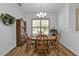 A well-lit dining room with a wooden table, chairs, and built-in shelving at 1766 Dunvegan Dr, Punta Gorda, FL 33980