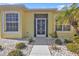 Inviting front entrance with decorative screen door and well-maintained landscaping at 1766 Dunvegan Dr, Punta Gorda, FL 33980
