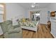 Main bedroom with sliding doors to the outside, a large bed and a sitting chair at 1766 Dunvegan Dr, Punta Gorda, FL 33980
