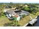 Aerial view showcasing home, pool, dock, and canal at 18345 Ohara Dr, Port Charlotte, FL 33948