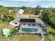 Aerial view of a home with a solar heated pool and shed at 18345 Ohara Dr, Port Charlotte, FL 33948