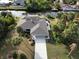 Aerial view of canal-front home with pool, dock, and lush landscaping at 18345 Ohara Dr, Port Charlotte, FL 33948