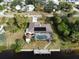 Bird's-eye view showcasing home with solar panels, pool, and private dock at 18345 Ohara Dr, Port Charlotte, FL 33948