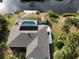 Aerial view of home with pool, dock, and lush landscaping at 18345 Ohara Dr, Port Charlotte, FL 33948