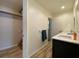 Bathroom with a walk-in closet and a door to another room at 18345 Ohara Dr, Port Charlotte, FL 33948