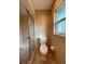 Updated bathroom with a toilet, shower, and tile flooring at 18345 Ohara Dr, Port Charlotte, FL 33948