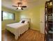 Bright bedroom with ceiling fan, double closet, and hardwood floors at 18345 Ohara Dr, Port Charlotte, FL 33948