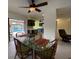 Dining area with glass table and view of kitchen and pool at 18345 Ohara Dr, Port Charlotte, FL 33948