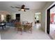 Casual dining area with glass-top table and chairs, open to living room at 18345 Ohara Dr, Port Charlotte, FL 33948