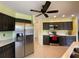 Modern kitchen with stainless steel appliances and dark wood cabinets at 18345 Ohara Dr, Port Charlotte, FL 33948