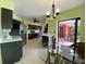 Open concept kitchen with stainless steel appliances and view of the outdoor patio at 18345 Ohara Dr, Port Charlotte, FL 33948