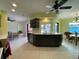 Bright open-concept kitchen and dining area featuring modern appliances and direct views of the outdoor pool at 18345 Ohara Dr, Port Charlotte, FL 33948