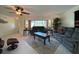 Relaxing living room with ample seating, large window and ceiling fan at 18345 Ohara Dr, Port Charlotte, FL 33948
