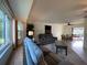 Relaxing living room with gray sofa and access to backyard at 18345 Ohara Dr, Port Charlotte, FL 33948