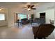 Comfortable living room with large windows, seating, and ceiling fan at 18345 Ohara Dr, Port Charlotte, FL 33948