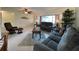 Spacious living area featuring comfy sofas, a coffee table, and ceiling fan at 18345 Ohara Dr, Port Charlotte, FL 33948