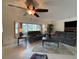 Spacious living room featuring neutral-toned walls, tile flooring, and comfortable seating with plenty of natural light at 18345 Ohara Dr, Port Charlotte, FL 33948