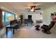 Bright living room with comfy seating, large window, and adjacent dining area at 18345 Ohara Dr, Port Charlotte, FL 33948