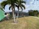 Screened pool and patio with lush landscaping at 18345 Ohara Dr, Port Charlotte, FL 33948