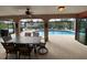 Spacious covered patio overlooking a refreshing pool at 18345 Ohara Dr, Port Charlotte, FL 33948