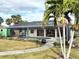 Relaxing pool area with screened enclosure and lush landscaping at 18345 Ohara Dr, Port Charlotte, FL 33948
