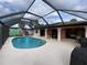 Enjoy the screened-in pool and patio area at 18345 Ohara Dr, Port Charlotte, FL 33948
