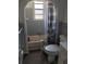 Bathroom with shower/tub combo and grey tile at 205 Chasteen St, Punta Gorda, FL 33950