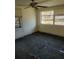 Bedroom with damaged flooring and a ceiling fan at 205 Chasteen St, Punta Gorda, FL 33950