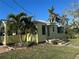 Yellow house with palm trees and a spacious yard at 205 Chasteen St, Punta Gorda, FL 33950