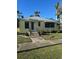 House exterior, featuring a yellow facade and landscaping at 205 Chasteen St, Punta Gorda, FL 33950