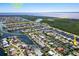 Aerial view of waterfront community with canal access, showcasing numerous homes and boat docks at 210 Divinci Dr, Punta Gorda, FL 33950