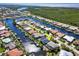 Waterfront property featuring beautiful canal views, direct access to open water, and lush landscaping at 210 Divinci Dr, Punta Gorda, FL 33950