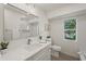 Renovated bathroom with white cabinets, modern fixtures, and a bright window at 210 Divinci Dr, Punta Gorda, FL 33950