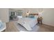 Cozy bedroom with natural light, neutral tones, and a view of the outdoor living space at 210 Divinci Dr, Punta Gorda, FL 33950