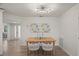 Well-lit dining room with a wooden table, decor art, and views to other spaces at 210 Divinci Dr, Punta Gorda, FL 33950