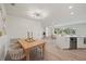 Open-concept dining area featuring an open design with sightlines into the kitchen and living area at 210 Divinci Dr, Punta Gorda, FL 33950
