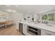 Open-concept kitchen featuring a wine cooler, stainless steel appliances, and modern finishes at 210 Divinci Dr, Punta Gorda, FL 33950