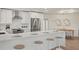 Bright kitchen features stainless appliances, white cabinets and marble counters at 210 Divinci Dr, Punta Gorda, FL 33950