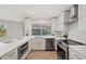 Modern kitchen featuring stainless steel appliances, sleek countertops, and ample cabinet space at 210 Divinci Dr, Punta Gorda, FL 33950