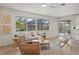 Bright living room showcases tile floors, stylish furniture, and views of the pool area at 210 Divinci Dr, Punta Gorda, FL 33950