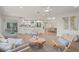 Open living room showcasing contemporary furniture and kitchen at 210 Divinci Dr, Punta Gorda, FL 33950