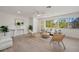 Bright living area with tile floors, natural light, modern decor, and open space concept at 210 Divinci Dr, Punta Gorda, FL 33950