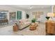Open living space showcases neutral decor, tile floors, and sliders to the outdoor living at 210 Divinci Dr, Punta Gorda, FL 33950