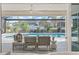 Outdoor living area features a covered patio, a ceiling fan, and a swimming pool at 210 Divinci Dr, Punta Gorda, FL 33950