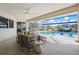 Covered patio with seating area and view of pool and canal at 210 Divinci Dr, Punta Gorda, FL 33950