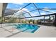 This screened-in pool area offers a beautiful view of the surrounding waterway and a private boat dock at 210 Divinci Dr, Punta Gorda, FL 33950